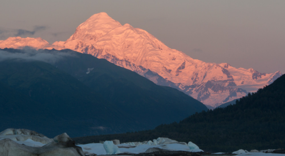 Aplenglow on Mt Fairweather, rising above Alsek lake